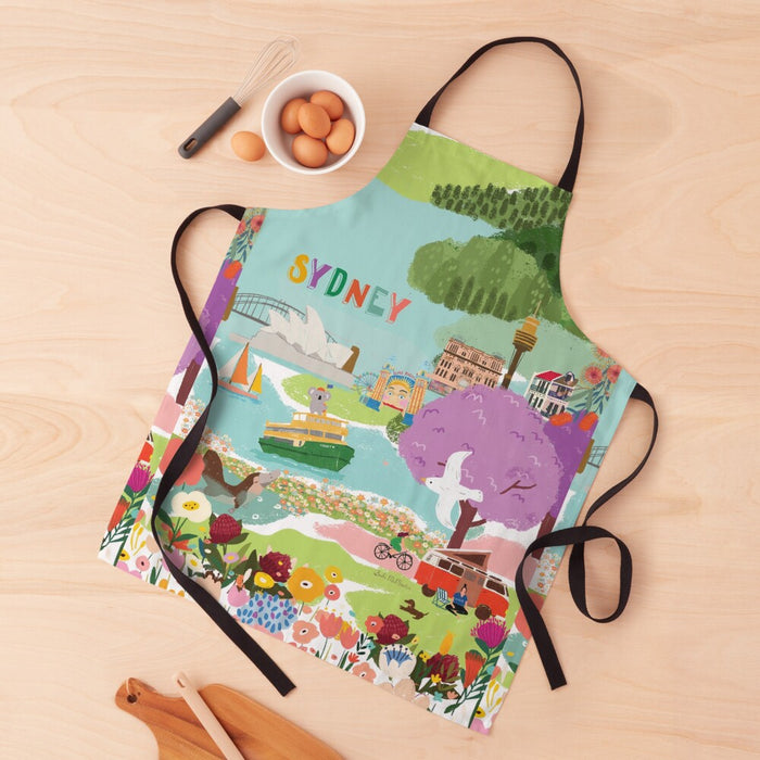 Vibrant Sydney souvenir apron featuring colorful illustrations of the Opera House, Harbour Bridge, Sydney Tower, ferries, flowers, and iconic Australian scenery – perfect Australian kitchen gift or travel keepsake.